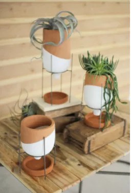 Set Of Three Natural And White Clay Pots On Wire Stands
