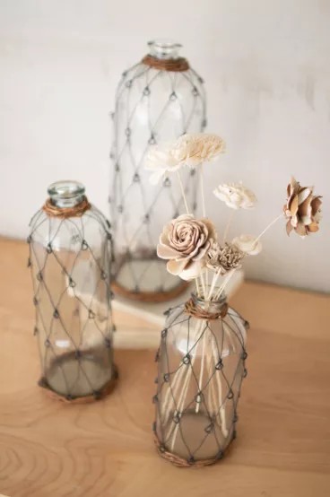 Set Of Three Tall Wire And Wicker Wrapped Glass Bottles