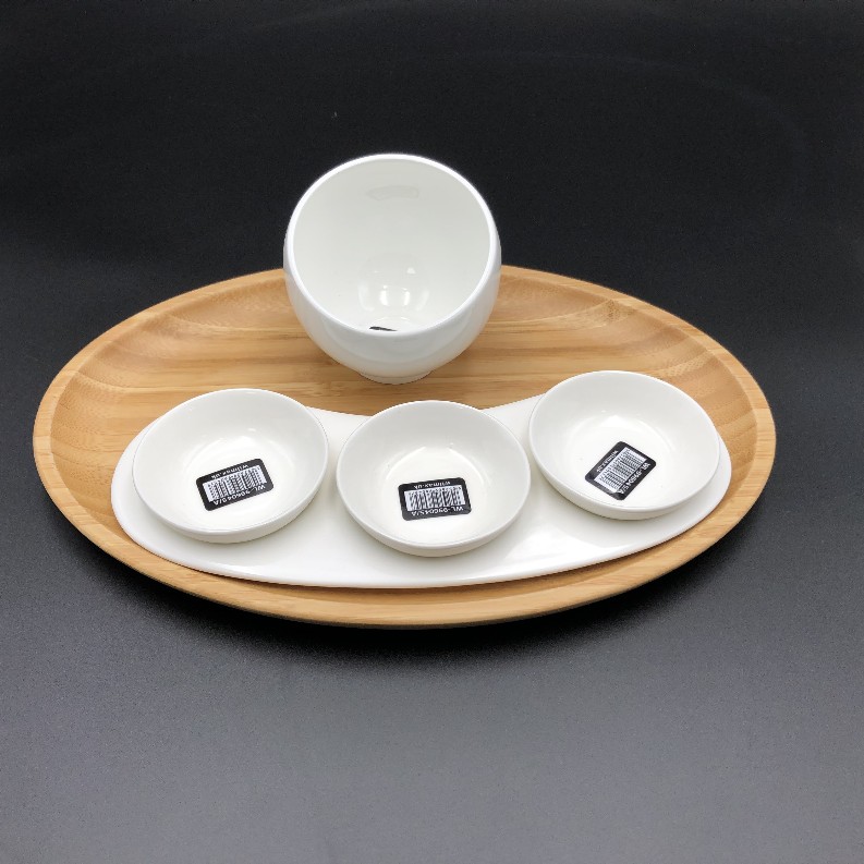 A mignardises (petit four) serving set with Bamboo oval tray and Porcelain dishes to match