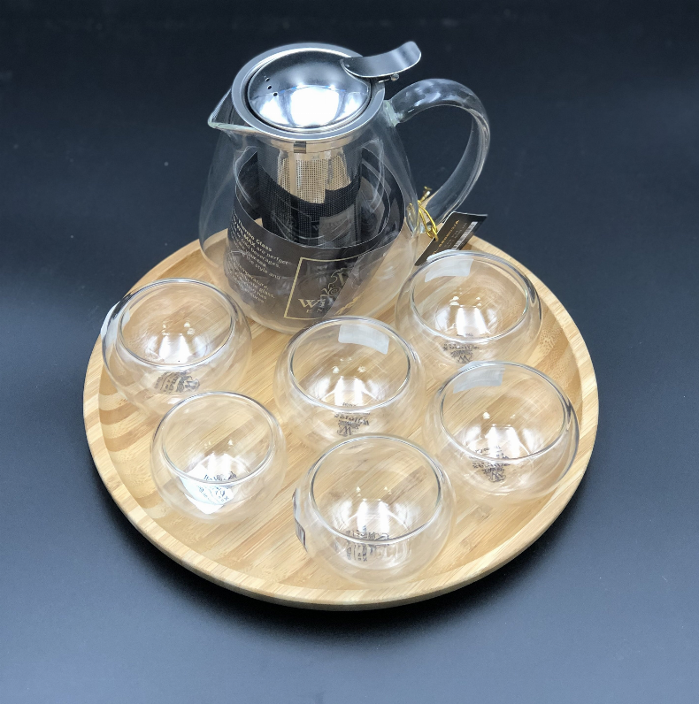 Small Asian tea thermo set with 6 bowls for serving and a Bamboo serving tray